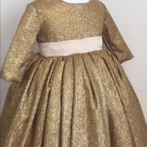 Gold dress with pink bow